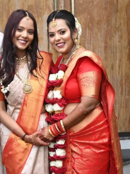 A lovely moment between the bride and her sister, both wearing sarees I pre-pleated for the muhurtham. The service allowed them to get ready quickly while ensuring a perfect traditional look.
