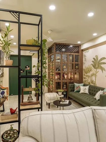A wide shot of the living room from image 22, showing the open layout and iron partition.