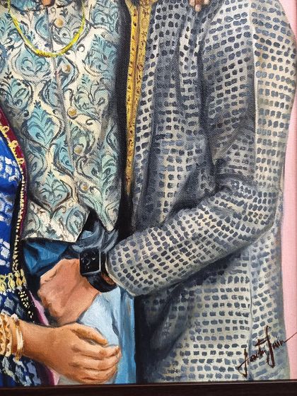 A detail shot of the intricate patterns on the father's and son's kurtas.