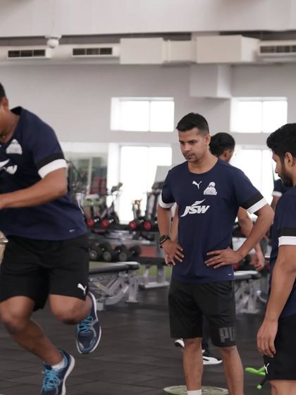 Watching over a plyometric drill. My role is to ensure every jump is explosive and safe.