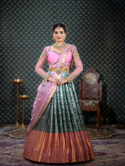 Another full-length shot of the pink and green half-saree, showing the complete outfit and styling.
