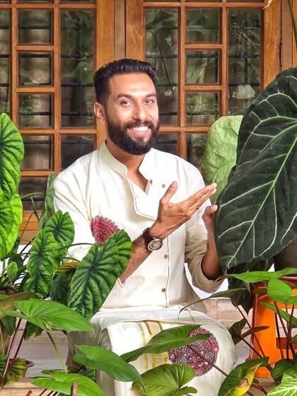It is always fun to take photos with plants. Here I am with my collection of Aroids, including this magnificent Anthurium Magnificum.