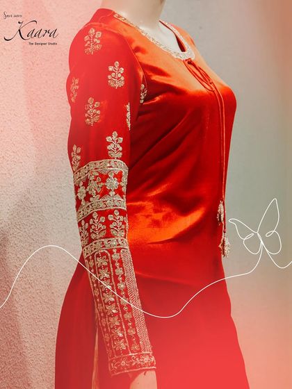 A detailed shot of the sleeve of our red velvet kurta. The intricate zardosi and threadwork create a beautiful, traditional pattern, making this a standout feature of the ensemble.