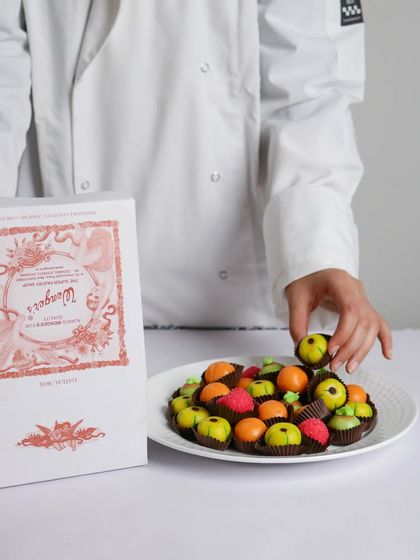 A plate of our fruit-shaped marzipan. These colourful, almond-based sweets are handcrafted by our chefs and are as beautiful as they are delicious.