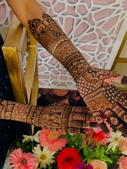 This shot captures the rich texture and detail of a full bridal mehendi, with figures and patterns clearly visible.