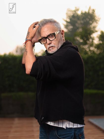 An outdoor portrait of a senior model, using the soft, natural light of a cloudy day to create a thoughtful and compelling image.