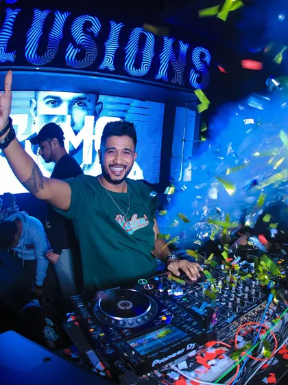A huge smile and a hand up during a confetti blast. This shot perfectly captures the fun and excitement of my sets.