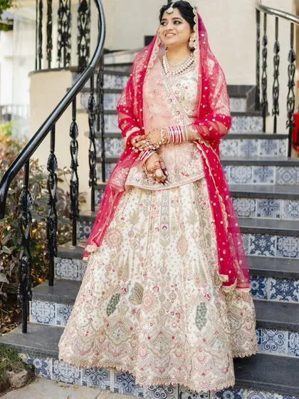 A series showcasing a beautiful sunset wedding look. The bride's makeup is soft and romantic, with a flawless base and defined eyes, perfectly complementing her stunning pastel lehenga for a picturesque Goa wedding.
