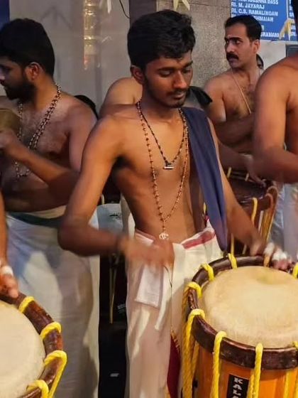A performance during the Mandala masa festival at Ulsoor Ayyappan Temple, Bangalore. This image captures the synchronized power of the Chenda and the shimmering rhythm of the Ilathaalam.