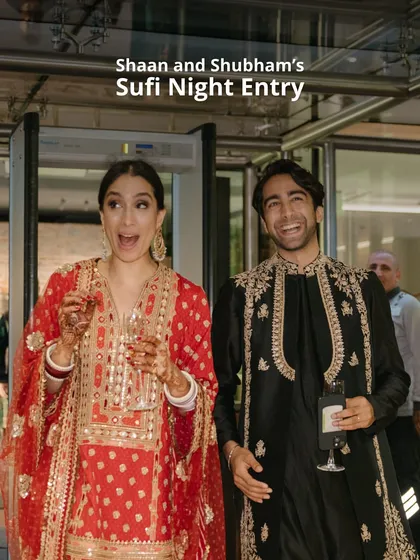 The pure joy on Shaan and Shubham's faces as they make their entrance at the Sufi Night. Holding glasses of champagne, their expressions capture the excitement and happiness of the moment.