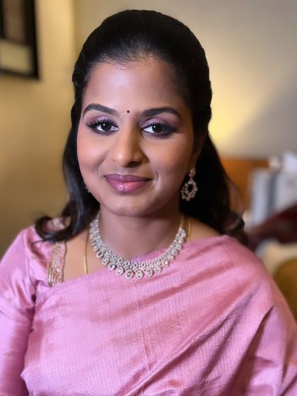 Another shot of Akshaya's engagement look. The makeup is fresh and celebratory, perfect for a family member's big day.