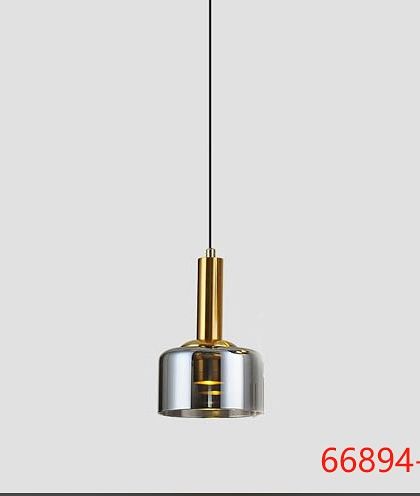 A single pendant light with a smoked glass shade and brass fitting. This classic design is versatile enough for kitchens, hallways, or bedsides.
