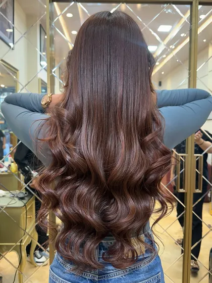 This client is showing off her gorgeous Mocha Mousse hair. The color looks incredibly healthy and vibrant, perfect for any celebration.