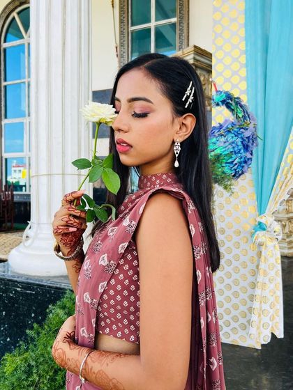 Another beautiful, soft-focus shot. The simple hair accessory adds a touch of sparkle to the straight, sleek hairstyle.