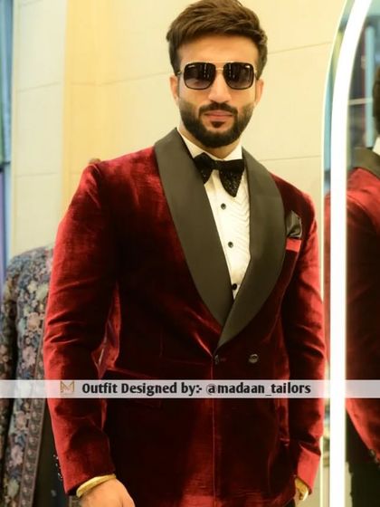 The rich texture of this red velvet tuxedo is undeniable. Paired with a classic bow tie, it's a powerful look for a reception or cocktail evening.