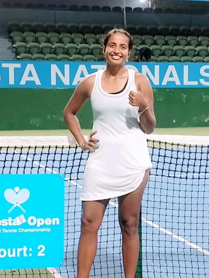 Riya Bhatia gives a thumbs-up on court after winning a tough three-set match to move into the next round of the Fenesta Nationals.