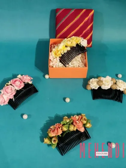 Floral hair combs make for a unique and beautiful Mehendi favour. I craft these with high-quality artificial flowers in various colors, so your guests have a lovely keepsake to wear.