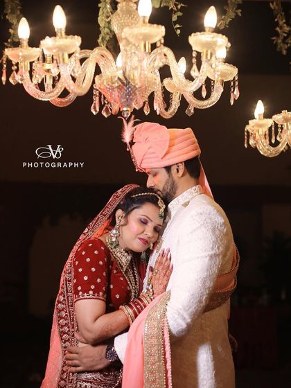 A classic and loving embrace, this wedding portrait captures the couple in a timeless pose, radiating warmth and happiness.