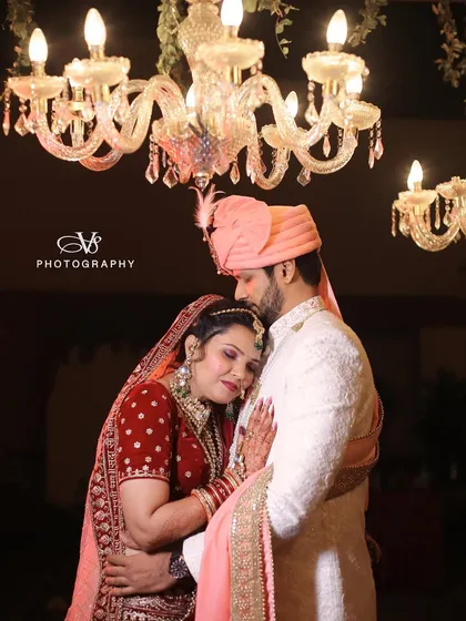 A classic and loving embrace, this wedding portrait captures the couple in a timeless pose, radiating warmth and happiness.