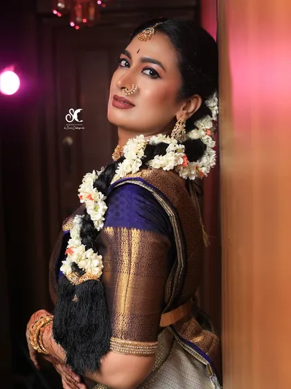 I've had the pleasure of working with many Sandalwood celebrities, like the wonderful Shwetha Srivatsav here. This look showcases my expertise in creating camera-ready makeup that is flawless for professional photoshoots and events.