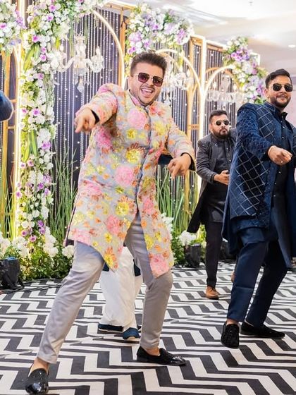 A candid shot capturing the raw energy of a group performance. This is what it's all about: friends coming together, having a blast, and creating a memory on the dance floor.