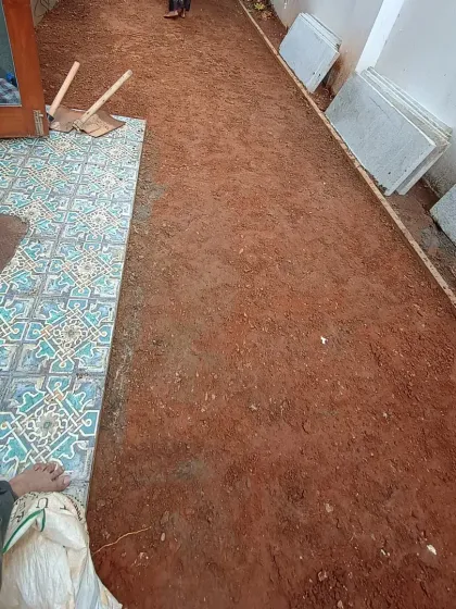The first step in this backyard makeover was to completely clear the area and level the soil, creating a clean slate for the new design.