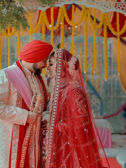 A beautiful portrait of the couple under the wedding canopy. Her makeup looks stunning in the natural daylight.