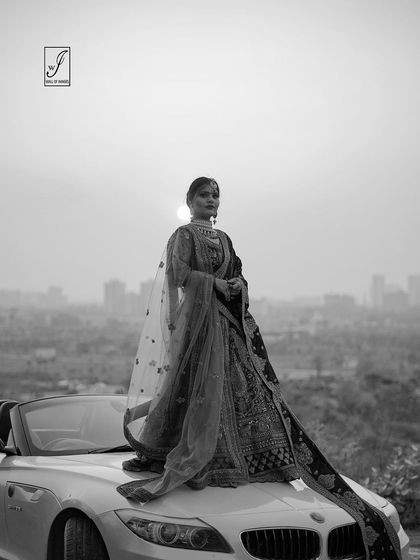 A close-up black and white version that brings attention to the intricate details and the model's expression without the distraction of color.