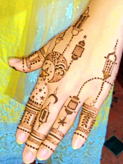 A close-up of the beautiful moon and lantern design. The details on the hanging lanterns and the crescent moon are delicate and precise, making this a truly special piece of art.