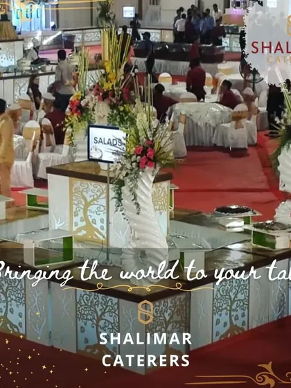 Bringing the world to your table. This image shows a massive, custom-designed salad and cold-cuts station, demonstrating our ability to create unique and grand buffet setups.