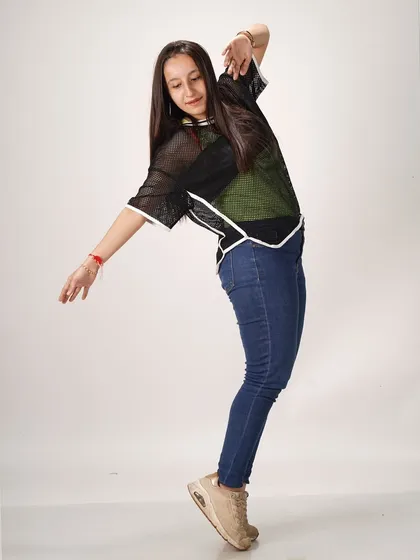 A studio photoshoot where my vibe does the talking. This pose captures the fluid and dynamic nature of my dance style.