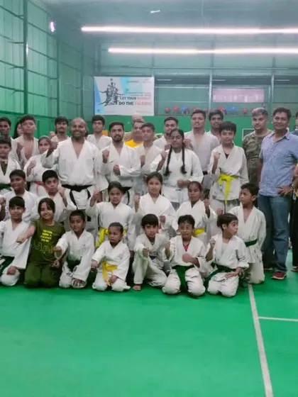 Students, coaches, and parents together after a belt grading exam, celebrating the progress and hard work of the kids.