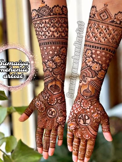 Engagement henna with personalized initials 'AP' and wedding ring symbols.