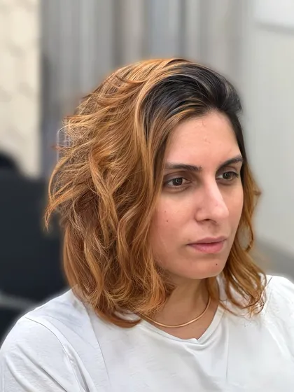 I call this look '24k Gold Copper'. It’s a rich, warm color that I custom-blended to create a sun-kissed, metallic effect. Paired with a messy, textured haircut, it gives off a relaxed, beachy vibe while still looking incredibly luxurious.