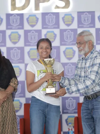 Harini receiving the Best Shooter award trophy at the CBSE South Zone Competition. This award recognizes her as the top scorer across all age categories, both boys and girls.