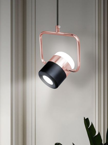 Shown against a classic wall moulding, this modern pendant creates a beautiful contrast. Mixing styles can lead to very interesting and personal interior design.