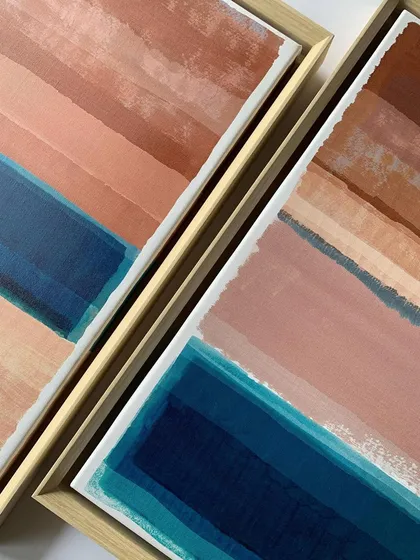 A detail shot of two abstract artworks in their custom floater frames. This view shows the clean, consistent gap between the canvas edge and the frame, a hallmark of professional float framing that I specialize in.