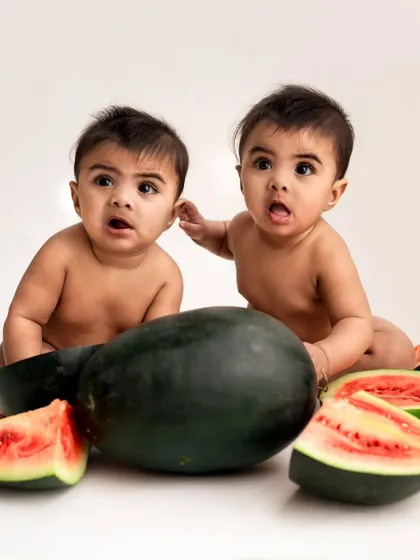 Double the fun with a watermelon theme! These twin boys look so surprised and adorable surrounded by fresh watermelon slices in this cute summer shoot.