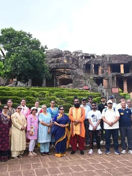 A group photo at the historic Udayagiri caves in Odisha, part of our Puri Yatra excursions.