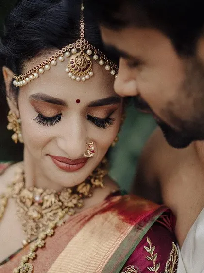 In a quiet moment away from the ceremonies, I love to capture the simple, soulful connection between a couple. This intimate portrait, framed by nature, speaks volumes about their bond, showcasing the quiet beginning of their shared journey.