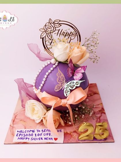 Another view of the unique spherical cake celebrating "Happy Silver Neha" on her 25th birthday.