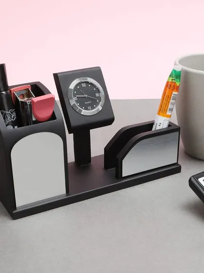 A lifestyle shot of a wooden desk organizer with a clock, photographed in a realistic office setting. This approach helps customers visualize the product in their own space, making it ideal for website and catalog use.