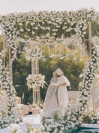 An all-white floral mandap creates an ethereal and heavenly atmosphere. I used masses of white flowers and hanging glass birds to build this structure, offering a serene and elegant space for the wedding ceremony.