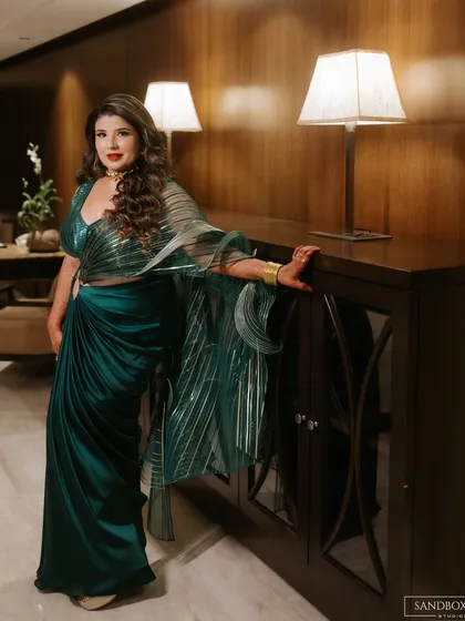 A series of portraits showcasing the bride's elegant and modern reception look, highlighting the details of her designer saree.