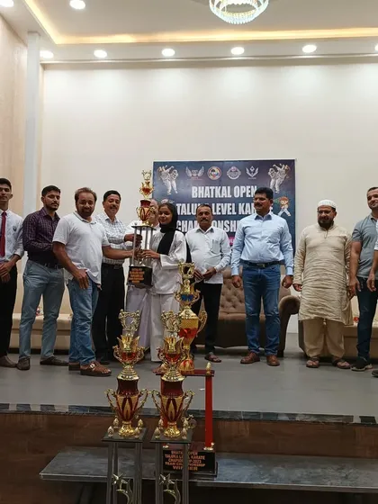 My student Shiza Shabandri holding her Grand Championship trophy. Her success is an inspiration to all the young girls in my academy.