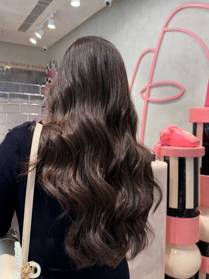 New hair, new vibe. This client is feeling unstoppable in her new ash brown color, styled into beautiful, flowing waves.