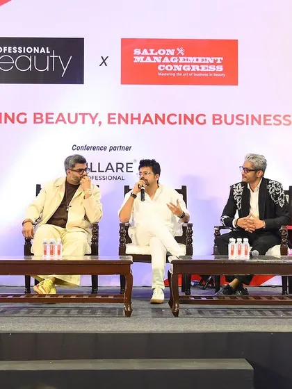Another shot from the panel discussion at the Salon Management Congress, engaging in conversation about empowering beauty and enhancing business.