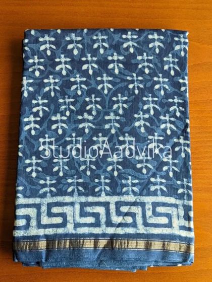 An indigo Dabu print silk cotton saree. The intricate patterns and the rich blue color make this a truly special piece for lovers of traditional Indian crafts.