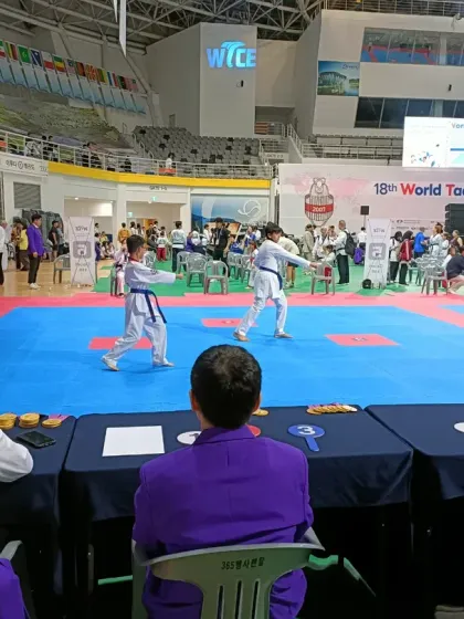 My students competing in Poomsae (forms) under the watchful eyes of international judges at the World Taekwondo Culture Expo.