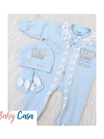 This light blue romper set is fit for "The New Boss." It features delicate lace trim, a sparkling crown, and comes with a personalized cap and mittens for a complete, stylish look.